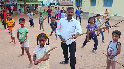 Every evening at 5.30pm, S Pandi holds free silambam classes for about 300 underprivileged students at Raj Martial Arts Arakkattalai. (Photo | K K Sundar, EPS)