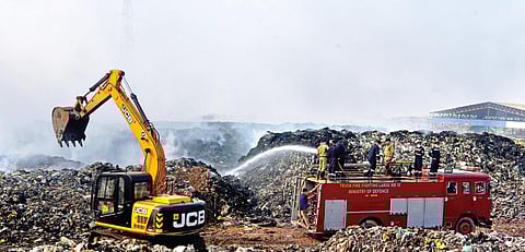 Fire and Rescue Services personnel dousing the blaze at Brahmapuram waste treatment plant in Kochi | FILE PIC