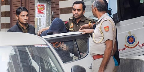 Aaftab Poonawala, accused of killing his partner Shraddha Walkar, being brought to his residence at Chhatarpur as part of the investigation. (File Photo |PTI)