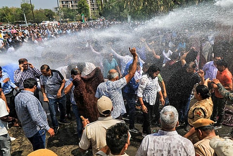 Police use water cannons to disperse doctors protesting against the Rajasthan Right to Health Bill, at Statue Circle in Jaipur, on March 21, 2023. (Photo | PTI)