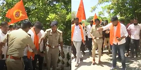 Police try to stop VHP and Bajrang Dal workers from sprinkling gomutra