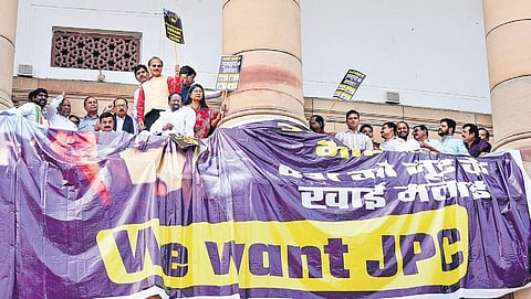 Opposition parties protest while demanding a JPC probe into the Adani issue during Budget Session at Parliament House in New Delhi, on Tuesday | PTI