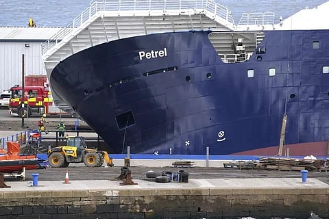 Emergency services work at Imperial Dock, where a ship has become dislodged from its holding and is partially toppled over, in Leith, Edinburgh, Scotland, Wednesday March 22, 2023. (Photo | AP)