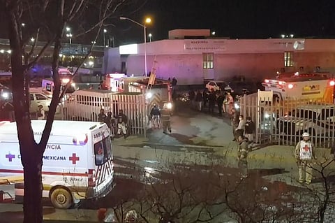 Image taken from a video showing ambulances and rescue teams staffers outside an immigration center in Ciudad Juarez, Mexico on Tuesday, March 28, 2023. (Photo | AP)