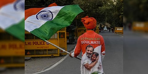 A Congress supporter outside the residence of party leader Rahul Gandhi, in New Delhi, Monday, March 27, 2023. (Photo | PTI)