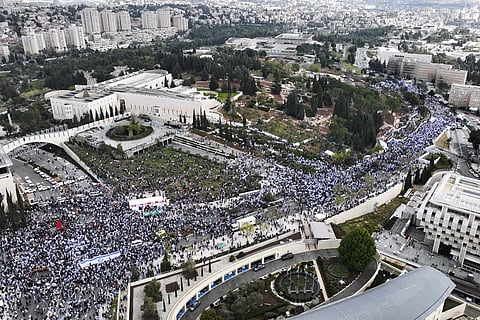 Tens of thousands of Israelis protest against Prime Minister Benjamin Netanyahu's judicial overhaul plan outside the parliament in Jerusalem, on March 27, 2023 (Photo | AP)
