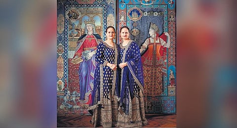 The Singh twins in front of their mural Photograph by: Christopher Doyle