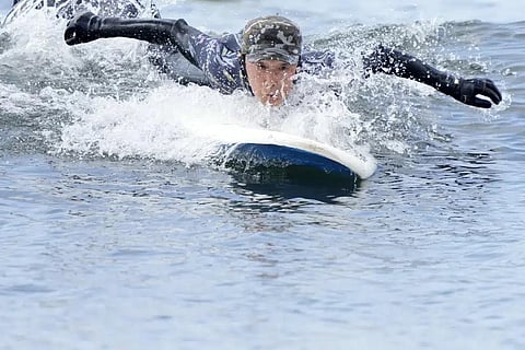 Seiichi Sano, an 89-year-old Japanese man, tries to ride a wave at Katase Nishihama Beach, Thursday, March 30, 2023, in Fujisawa, south of Tokyo. (Photo | AP)