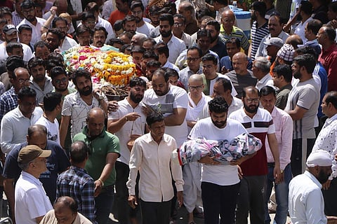 Kin carry bodies of victims of the accident in Indore. (Photo | AP)
