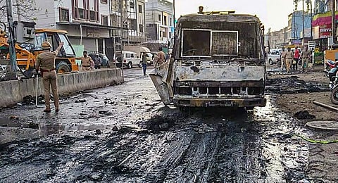 Charred remains of a vehicle after a clash between two groups near a Ram temple in Aurangabad. (Photo | PTI)