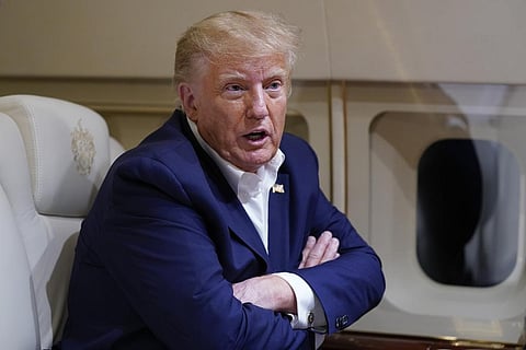 Former President Donald Trump speaks with reporters while in flight on his plane after a campaign rally at Waco Regional Airport, in Waco, Texas, Saturday, March 25, 2023 (Photo | AP)