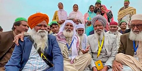 Reunion of the families of Sikh brothers -- Gurdev Singh and Daya Singh (in grey suit) -- who were separated during the partition at Kartarpur Corridor. (Photo | PTI)
