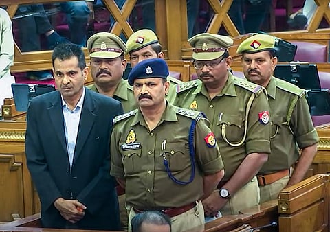 Six policemen in Uttar Pradesh Assembly before they were awarded imprisonment for a day by the House in Lucknow, March 3, 2023. (Photo | PTI)