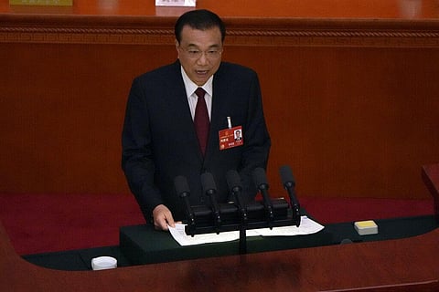 Chinese Premier Li Keqiang speaks during the opening session of China's National People's Congress (NPC) at the Great Hall of the People in Beijing, Sunday, March 5, 2023. (Photo | AP)