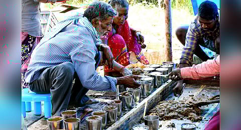  MBA graduate and his father involved sugarcane processing for organic jaggery at their farm land in Ramchandrapuram mandal of Tirupati district. (Photo | Madhav K, EPS) 