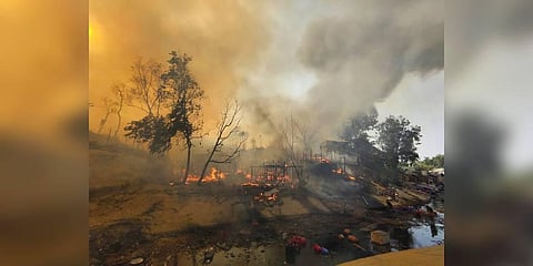 Rohingya refugees try to salvage their belongings after a major fire in their Balukhali camp at Ukhiya in Cox's Bazar district, Bangladesh on March 5, 2023. (Photo | AP)