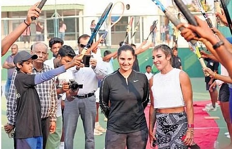 Students of Sania Mirza Tennis Academy welcoming the tennis star during a press meet in Hyderabad on Saturday | MANHAL
