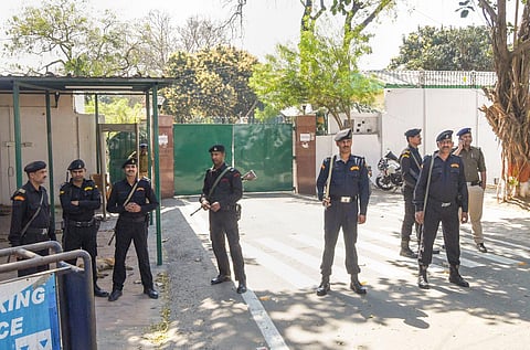 Security personnel deployed outside the residence of former Bihar chief minister Rabri Devi during a visit of CBI officials in connection with the land for jobs scam case, in Patna. (Photo | PTI)