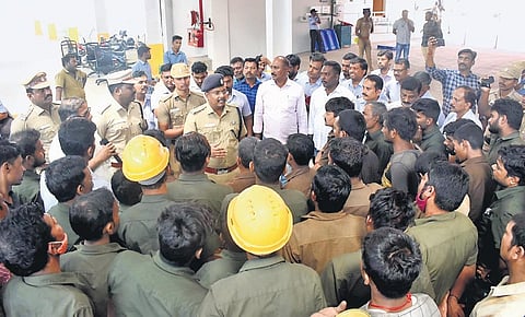Coimbatore SP Badri Narayanan interacts with the guest workers at a private company near Thudiyalur on Sunday; SP P Saravanan with workers at Kudankulam Nuclear Power Plant