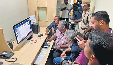 Police and revenue officials inspecting the Kozhikode office of Asianet News channel on Sunday | Express