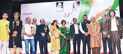 Prominent poets and other dignitaries pose at the inauguration of the event.