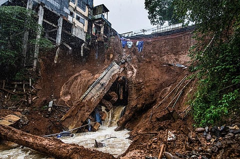 The foundation of a building on the edge of the ravine is seen following a landslide caused from heavy rains in the Caringin area, in Bogor on March 2, 2023. (Photo | AFP)