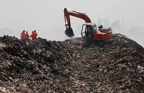 Fire and Rescue Services personnel from BPCL dousing the fire at Brahmapuram waste treatment plant. (Photo | T P Sooraj, EPS)
