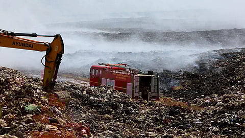 Fire and Rescue Services personnel from BPCL dousing the fire at the Brahmapuram waste treatment plant.