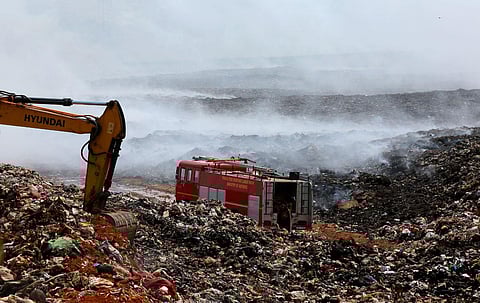 Fire and Rescue Services personnel from BPCL dousing the fire at Brahmapuram waste treatment plant. (Photo | T P Sooraj, EPS)