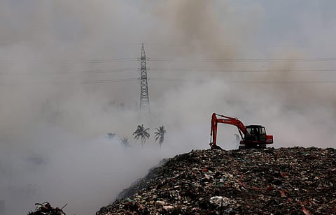 Firefighting operations being carried out at Brahmapuram waste treatment plant in Kochi. (Photo | T P Sooraj)