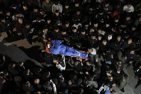 Palestinians carry the body of a man who was killed during an Israeli military raid in the West Bank city of Jenin, Tuesday, March 7, 2023. (Photo | AP)