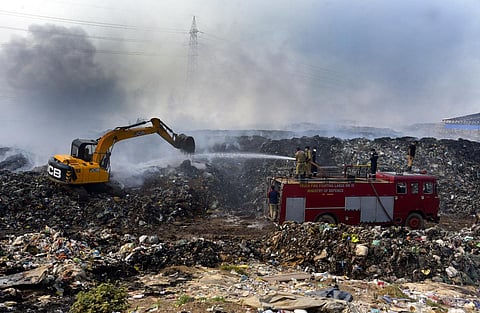 Fire and Rescue Services personnel try to douse the fire at Brahmapuram waste treatment plant in Kochi. (Photo | A Sanesh, EPS)