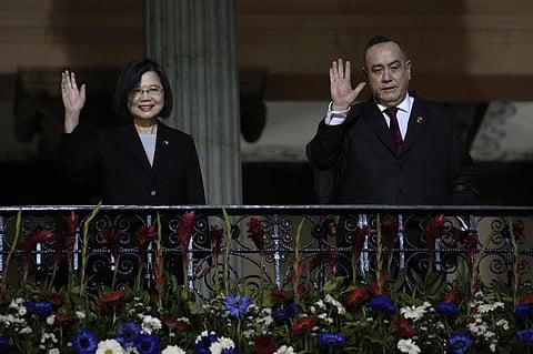 Taiwan's President Tsai Ing-wen, left, and Guatemala's President Alejandro Giammattei, wave from a balcony at the National Palace in Guatemala City, Friday, March 31, 2023. (Photo | AP)