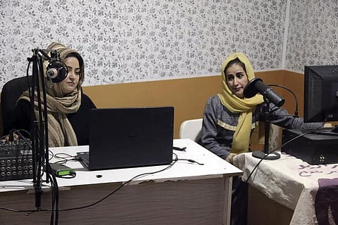 Najia Sorosh head of Sadai Banowan, left, speaks into a microphone in the broadcasting studio in Badakhshan province, north-eastern of Afghanistan, Wednesday, Jan. 4, 2023. (Photo | AP)