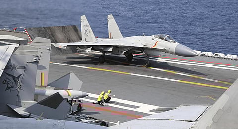 Photo released by Xinhua News Agency Chinese fighter jet prepares to take off from an aircraft carrier during the combat readiness patrol and military exercises around the Taiwan Island (File | AP)