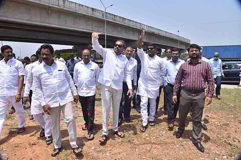IT Minister Gudivada Amarnath along with Special Chief Secy R Karikal Valaven inspecting the proposed Bhogapuram Airport site. (Photo | Express)