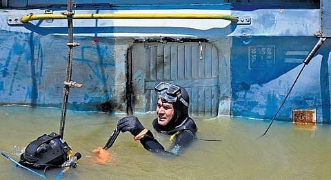  An emergency response team member during a demonstration of underwater rescue and retrieval from railway coaches in Bengaluru on Tuesday | Shashidhar Byrappa 