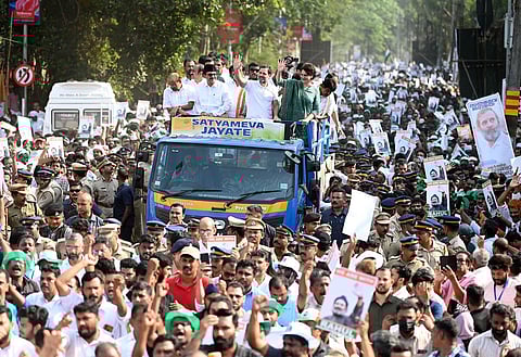 Congress leaders Rahul Gandhi and Priyanka Gandhi, accompanied by UDF leaders, wave at the crowd of supporters during a road show held at Kalpetta in Wayanad. (Photo | E Gokul, EPS)