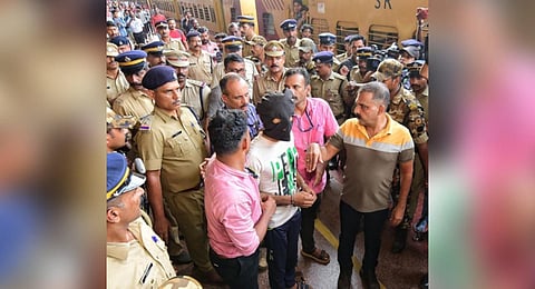 The special investigation team with Shahrukh Saifi, the accused in arson attack case, at Kannur railway station during evidence collection.
