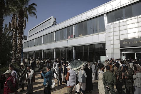 Yemeni gather at the airport ahead of a prisoners exchange in Sanaa, Yemen on Friday, April 14, 2023. (Photo | AP)