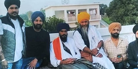 Waris Punjab De' chief Amritpal Singh's main aide Joga Singh (yellow turban) has been arrested by the Punjab Police, Saturday, April 15, 2023. (Photo | PTI)