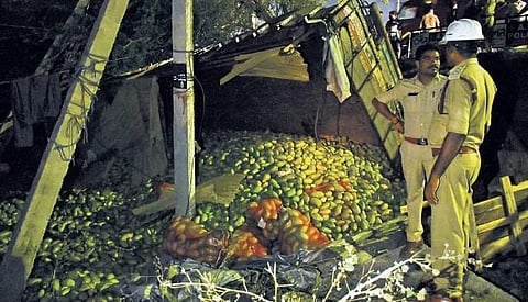 A truck carrying mangoes overturned near the Skew bridge I Prasant Madugula