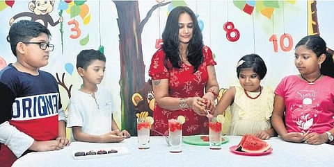 Home chef Priya Kolassery prepares summer coolers and popsicles with children at Tagore Kindergarten, Kumarapuram | B P Deepu