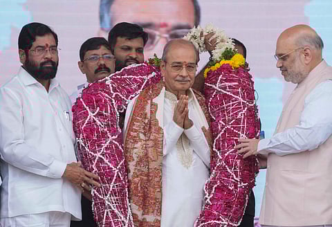 Amit Shah with Eknath Shinde and deputy CM Devendra Fadnavis during the presentation of Maharashtra Bhushan Award to Dattatraya Narayan Dharmadhikari. (Photo | PTI)