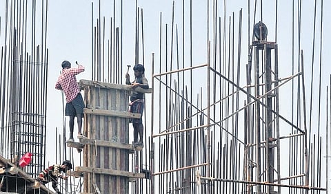 Representative Image: Migrant labourers working at a construction site under the scorching sun in the afternoon at Chakkai, Kerala.