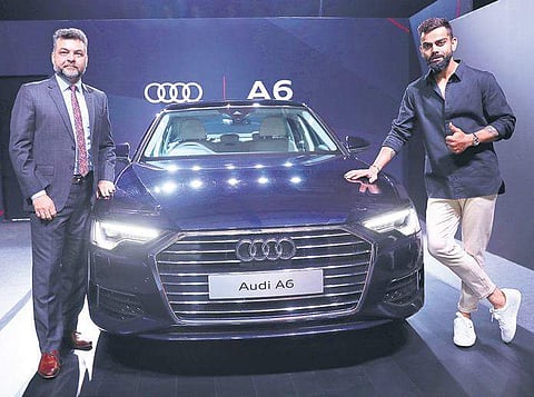 FILE: Indian cricket team captain Virat Kohli (R) and Audi India head Balbir Singh Dhillon (L) at the launch of the new Audi A6 in Mumbai, October, 2019. (Photo | EPS)