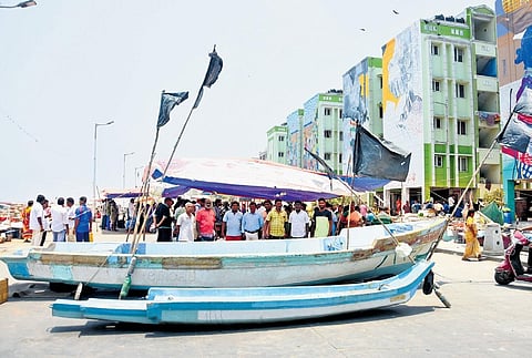 Fishermen and their family members continued with the protest by blocking the Loop road with their boats on Tuesday. (Photo | Ashwin Prasath, EPS)
