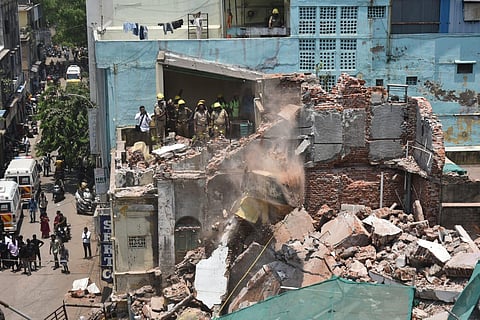 TN fire and rescue services personnel removing the debris from a collapsed building that was under renovation at Armenian church road, at Mannady in North Chennai. (Photo | P Jawahar, EPS)