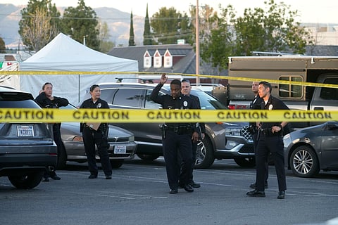 Police investigate the shooting site. (Photo | AP)