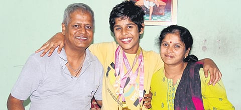 National gold medalist Nikhil Gowtham with his parents | G Satyanarayana
